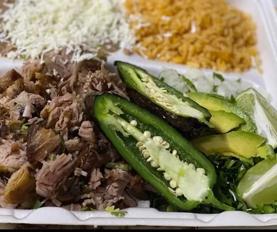 A carnitas plate at La Tapatía in Racine, with rice, beans, jalapeno and avocado